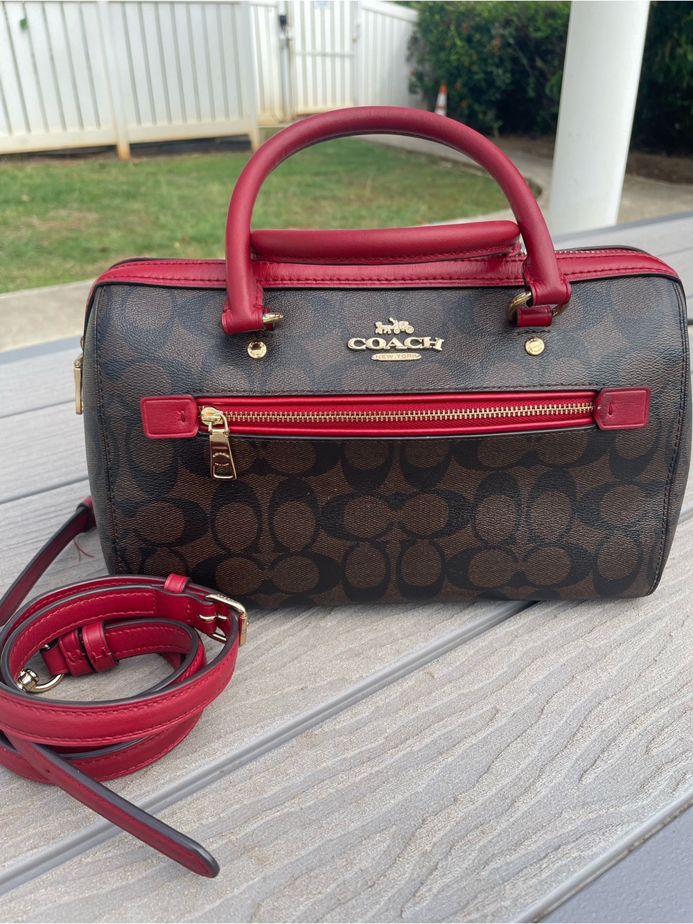 COACH Medium Brown Signature Rowen  with Red Trim and Handles
